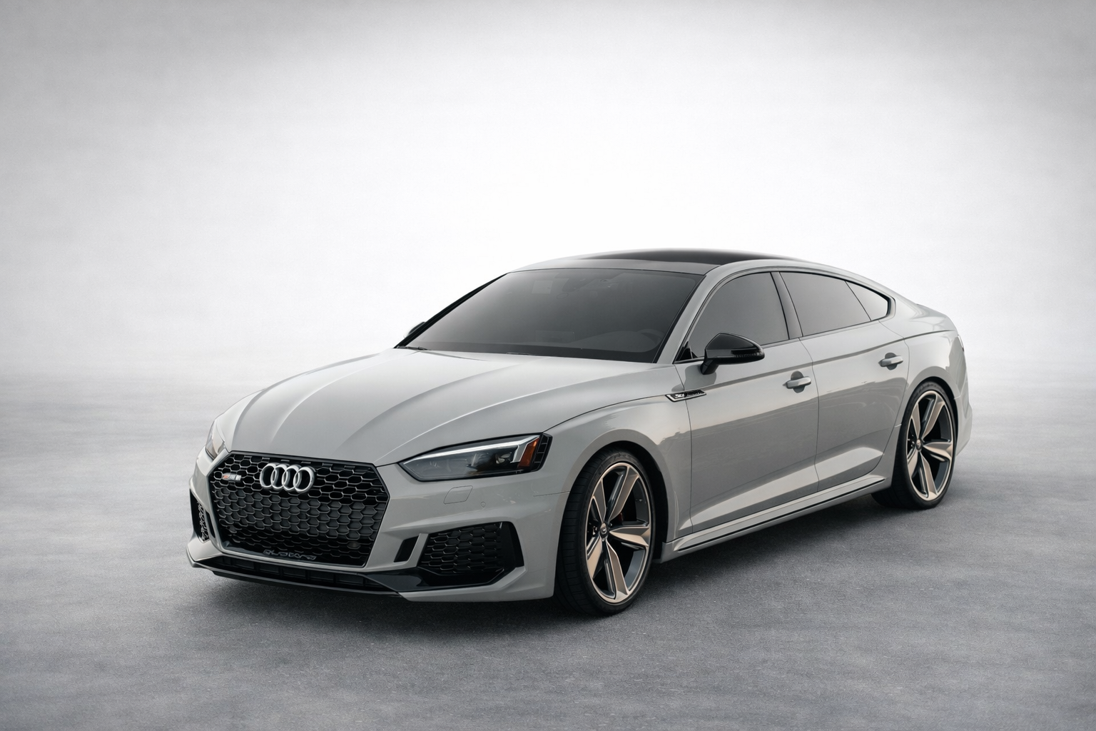 Professional carbon window tint installation on luxury Audi in San Diego